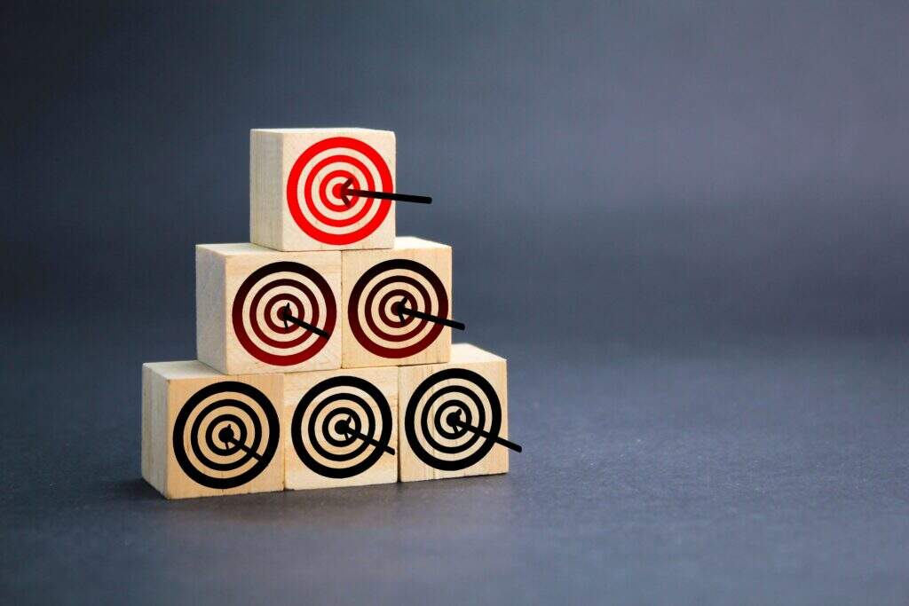 wooden block with target dart icon target concept something business growth - DT Network